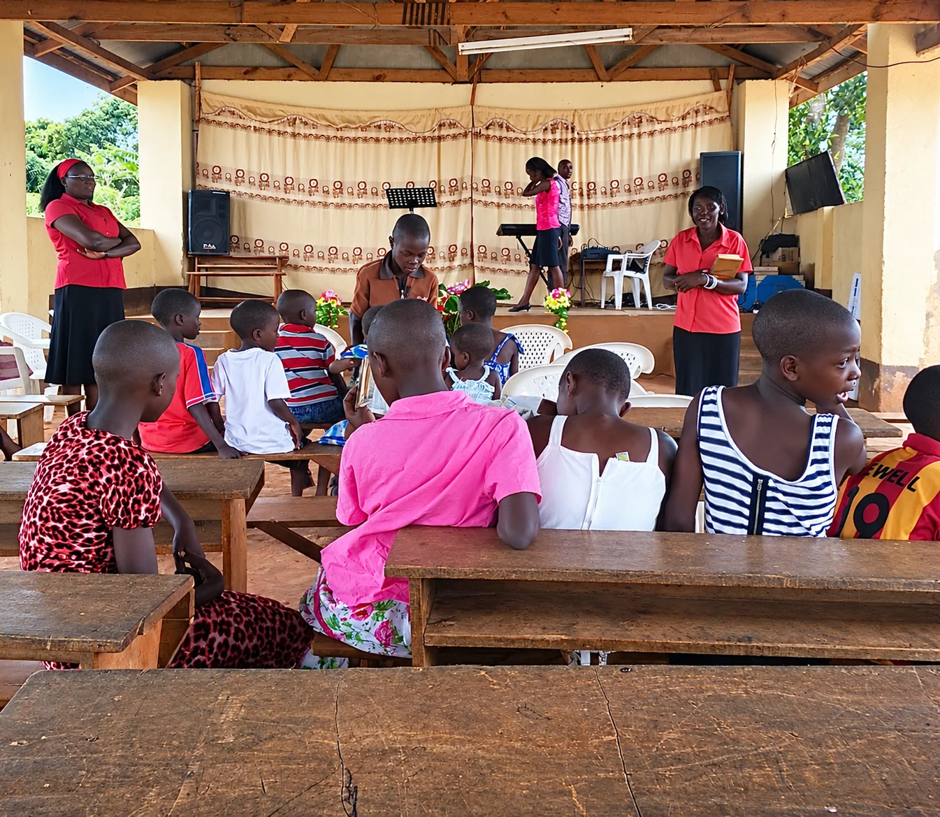 Children gathered for a community lesson