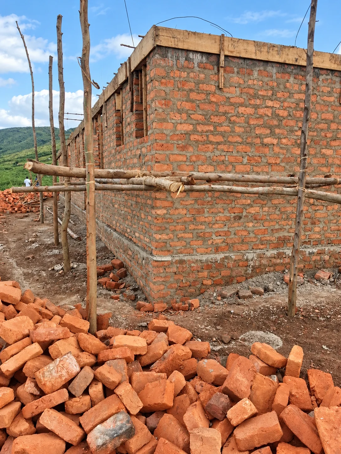 Brick walls rising at a construction site